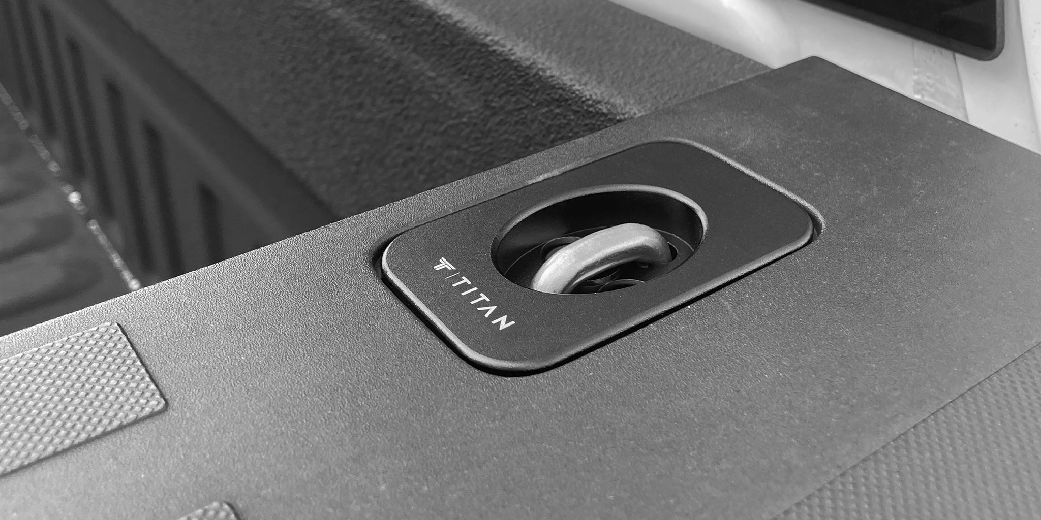 Titan Anchors Select Ford F-Series (F150, F250, F350) retractable anchor installed flush on truck bed rail cap.